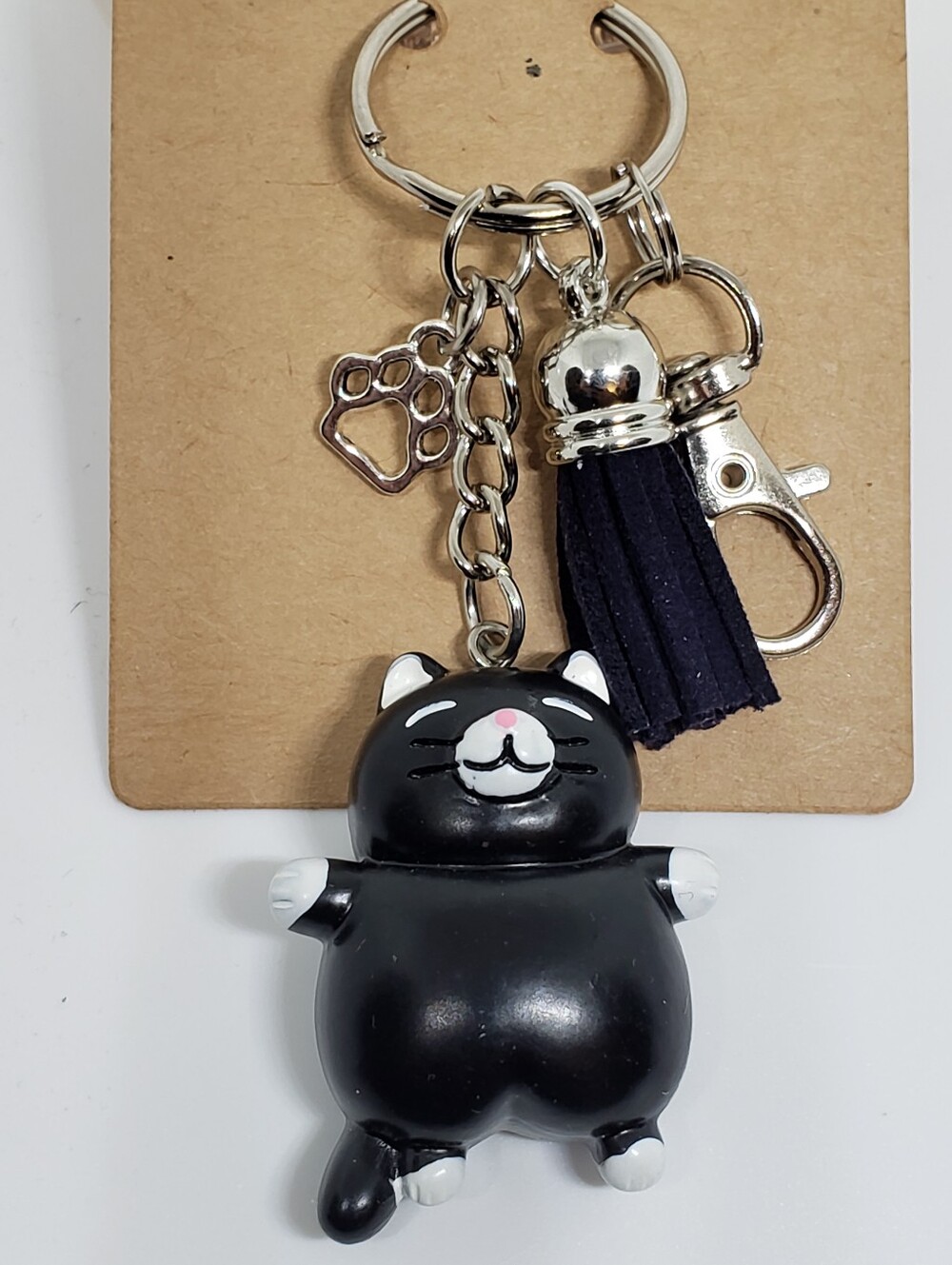 Handmade painted resin black white tuxedo cat paw keychain